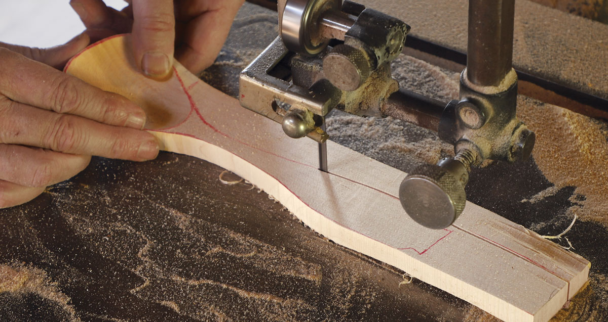 To the bandsaw. Once the bowl is shaped, saw along the spoon’s outlines. Leaving a few inches of extra material beyond the end of the handle will make it easier to grip in the vise while you carve.